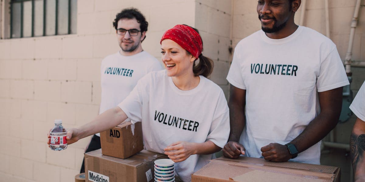 Volunteers working together at a community event