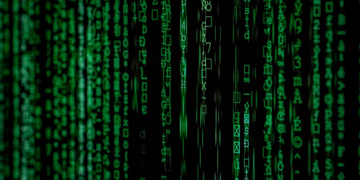 Code on multiple monitors showing structured data markup